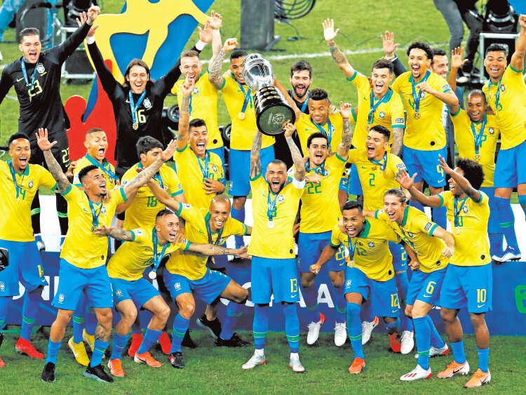 Brazil players celebrate with their trophy after a 3-1 victory over Peru in the final soccer match of the Copa America at the Maracana stadium in Rio de Janeiro, Brazil, Sunday, July 7, 2019. (AP Photo/Natacha Pisarenko)