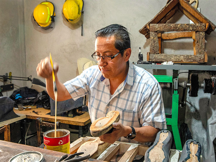 **EMBARGO: No electronic distribution, Web posting or street sales before Monday 3:01 a.m. ET May 6, 2019. No exceptions for any reasons. EMBARGO set by source.** José Luis Rivera prepares a sole of a shoe, in his workshop in Mexico City, Jan. 28, 2019. The cobbler makes handmade soccer cleats in a family workshop, preserving a tradition all but extinct in the era of mass production and NAFTA. (Brett Gundlock/The New York Times)