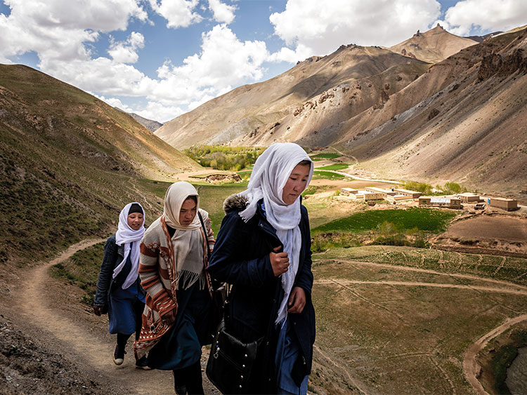 Students walk home from Rustam School in Yakawlang, Afghanistan, May 19, 2019. Despite having no computers, lights or heat, Rustam's 2017 graduating class saw 60 of 65 graduates accepted to Afghanistan's public universities, a 92 percent college entrance rate. Two-thirds of those accepted were girls. (Jim Huylebroek/The New York Times)