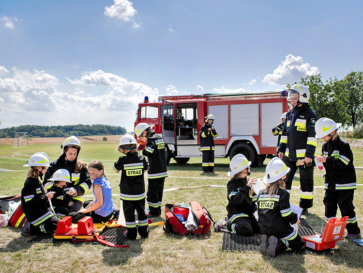 The all-girl young volunteer firefighters team in the village of Miejsce Odrzanskie, Poland, Aug. 1, 2019. Over nearly a decade, all 12 children born in the farming hamlet of Miejsce Odrzanskie have been girls, an oddity that has drawn international attention. (Kasia Strek/The New York Times)