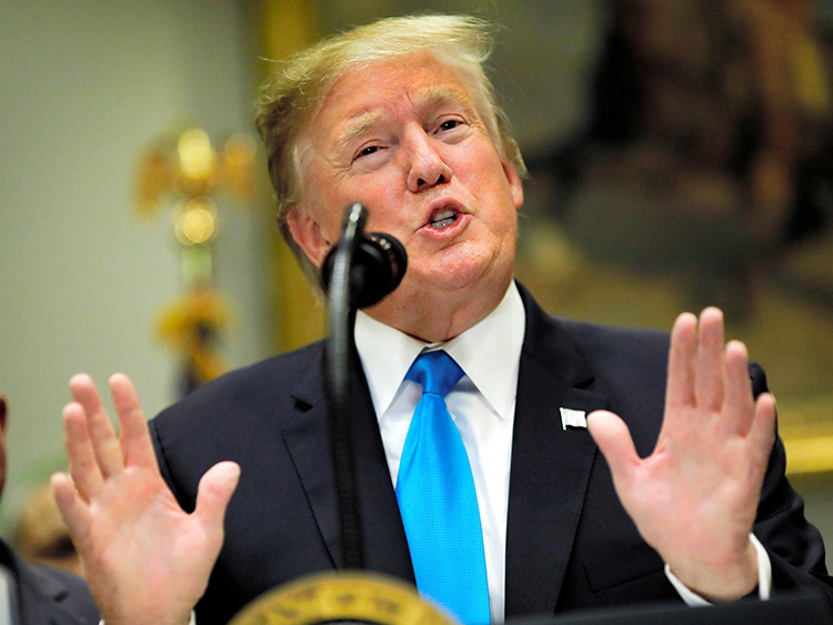 U.S. President Donald Trump speaks about a range of subjects including failed infrastructure talks with Democratic lawmakers, as Agriculture Secretary Sonny Perdue listens during an event to discuss administration efforts to