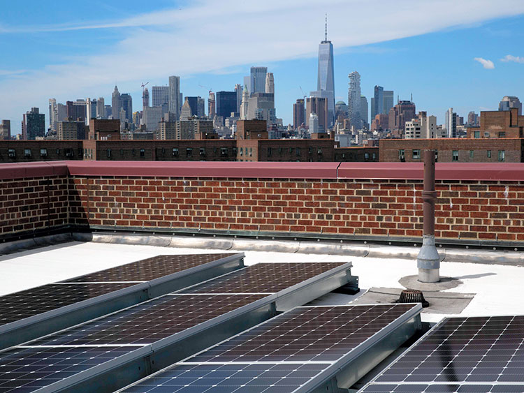Solar Panels on a roof in New York, June 11, 2019. Manhattan now has the country's biggest array of solar panels on an apartment complex and the Bronx could soon have a bigger one. (Gabriella Angotti-Jones/The New York Times)